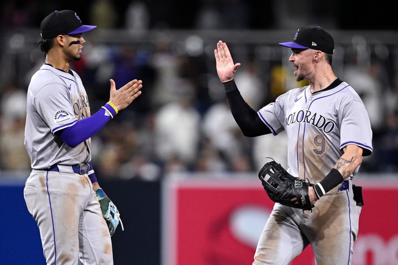 May 13, 2024; San Diego, California, USA; Colorado Rockies shortstop Ezequiel Tovar (left) celebrates on the field with center fielder Brenton Doyle (9) after defeating the San Diego Padres at Petco Park. Mandatory Credit: Orlando Ramirez-USA TODAY Sports