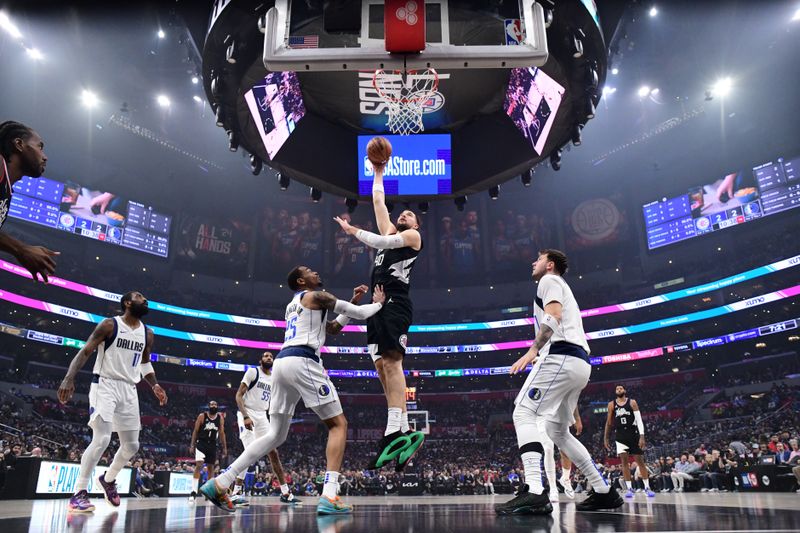 LOS ANGELES, CA - APRIL 23: Ivica Zubac #40 of the LA Clippers goes to the basket during the game against the Dallas Mavericks during Round 1 Game 2 of the 2024 NBA Playoffs on April 23, 2024 at Crypto.Com Arena in Los Angeles, California. NOTE TO USER: User expressly acknowledges and agrees that, by downloading and/or using this Photograph, user is consenting to the terms and conditions of the Getty Images License Agreement. Mandatory Copyright Notice: Copyright 2024 NBAE (Photo by Adam Pantozzi/NBAE via Getty Images)