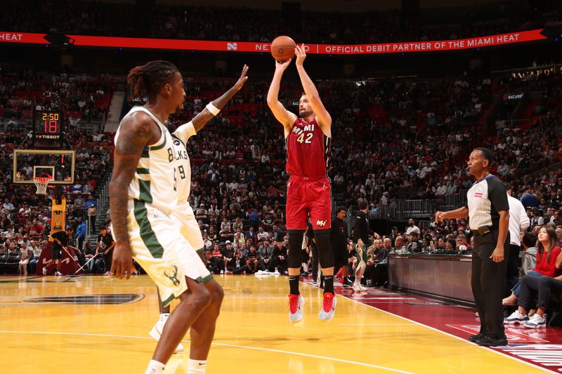 MIAMI, FL - NOVEMBER 26: Kevin Love #42 of the Miami Heat shoots a three point basket during the game against the Milwaukee Bucks during the Emirates NBA Cup game on November 26, 2024 at Kaseya Center in Miami, Florida. NOTE TO USER: User expressly acknowledges and agrees that, by downloading and or using this Photograph, user is consenting to the terms and conditions of the Getty Images License Agreement. Mandatory Copyright Notice: Copyright 2024 NBAE (Photo by Issac Baldizon/NBAE via Getty Images)