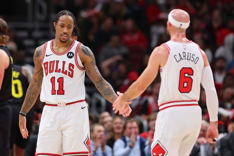 CHICAGO, ILLINOIS - NOVEMBER 06: DeMar DeRozan #11 and Alex Caruso #6 of the Chicago Bulls celebrate against the Utah Jazz during the second half at the United Center on November 06, 2023 in Chicago, Illinois. NOTE TO USER: User expressly acknowledges and agrees that, by downloading and or using this photograph, User is consenting to the terms and conditions of the Getty Images License Agreement. (Photo by Michael Reaves/Getty Images)