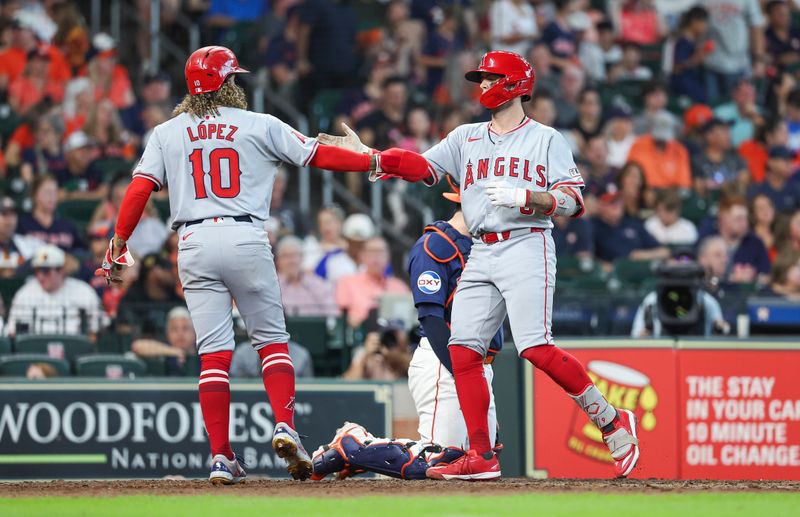 Sep 22, 2024; Houston, Texas, USA; Los Angeles Angels shortstop Zach Neto (9) celebrates with second baseman Jack Lopez (10) after hitting a home run during the sixth inning against the Houston Astros at Minute Maid Park. Mandatory Credit: Troy Taormina-Imagn Images