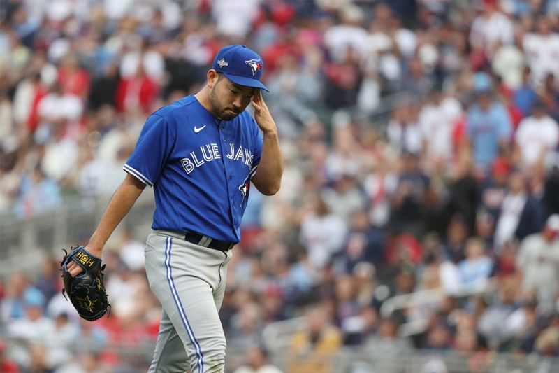 Oct 4, 2023; Minneapolis, Minnesota, USA; Toronto Blue Jays starting pitcher Yusei Kikuchi (16) leaves the mound in the fifth inning against the Minnesota Twins during game two of the Wildcard series for the 2023 MLB playoffs at Target Field. Mandatory Credit: Jesse Johnson-USA TODAY Sports