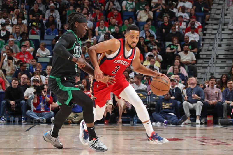 NEW ORLEANS, LA - MARCH 30: CJ McCollum #3 of the New Orleans Pelicans handles the ball during the game against the Boston Celtics on March 30, 2024 at the Smoothie King Center in New Orleans, Louisiana. NOTE TO USER: User expressly acknowledges and agrees that, by downloading and or using this Photograph, user is consenting to the terms and conditions of the Getty Images License Agreement. Mandatory Copyright Notice: Copyright 2024 NBAE (Photo by Layne Murdoch Jr./NBAE via Getty Images)