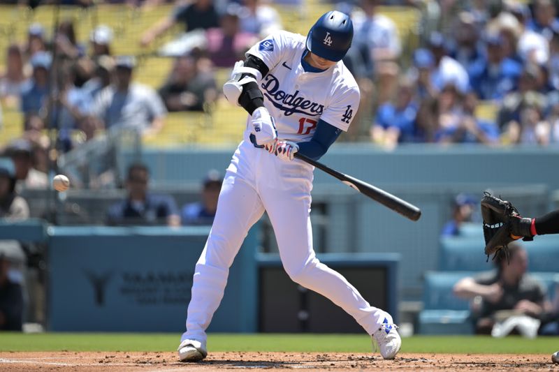 Apr 17, 2024; Los Angeles, California, USA; Los Angeles Dodgers designated hitter player Shohei Ohtani (17) singles in the first inning against the Washington Nationals at Dodger Stadium. Mandatory Credit: Jayne Kamin-Oncea-USA TODAY Sports