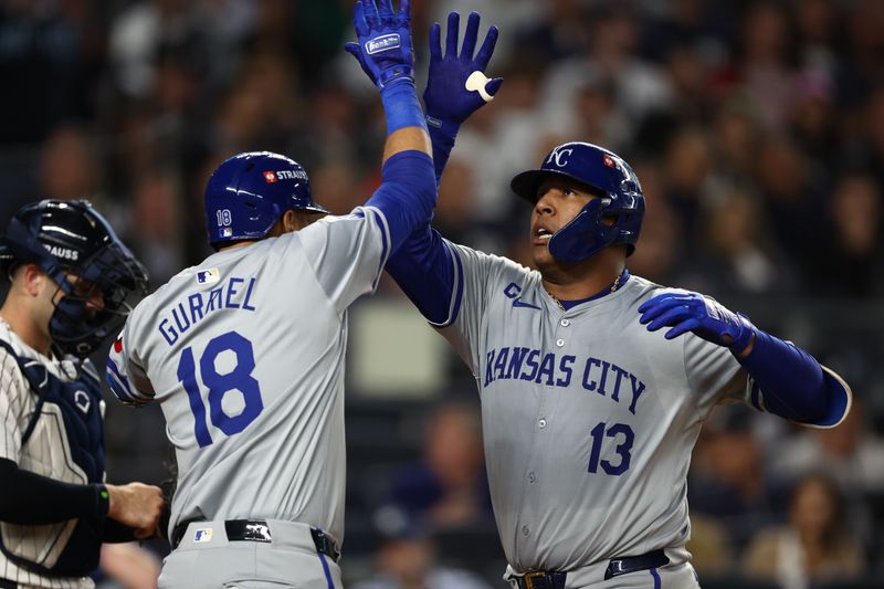 Oct 7, 2024; Bronx, New York, USA; Kansas City Royals catcher Salvador Perez (13) reacts after hitting a solo home run against the New York Yankees in the fourth inning during game two of the ALDS for the 2024 MLB Playoffs at Yankee Stadium. Mandatory Credit: Vincent Carchietta-Imagn Images