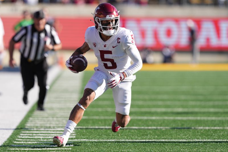 Nov 11, 2023; Berkeley, California, USA; Washington State Cougars wide receiver Lincoln Victor (5) runs after a catch against the California Golden Bears during the second quarter at California Memorial Stadium. Mandatory Credit: Darren Yamashita-USA TODAY Sports 