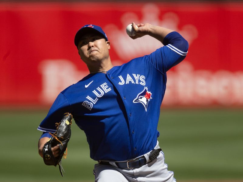 Sep 6, 2023; Oakland, California, USA; Toronto Blue Jays starting pitcher Hyun Jin Ryu (99) delivers a pitch against the Oakland Athletics during the first inning at Oakland-Alameda County Coliseum. Mandatory Credit: D. Ross Cameron-USA TODAY Sports