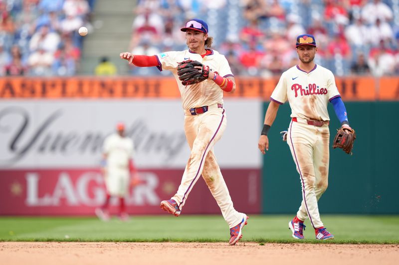 Apr 19, 2025; Philadelphia, Pennsylvania, USA; Philadelphia Phillies infielder Bryson Stott (5) throws to first against the Miami Marlins in the ninth inning at Citizens Bank Park. Mandatory Credit: Kyle Ross-Imagn Images