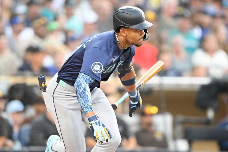 Jun 9, 2024; San Diego, California, USA; Seattle Mariners center fielder Julio Rodriguez (44) hits a single during the third inning against the San Diego Padres at Petco Park. Mandatory Credit: Denis Poroy-USA TODAY Sports at Petco Park. 