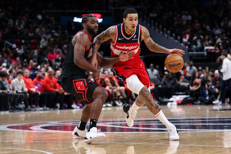 WASHINGTON, DC - JANUARY 01: Kyle Kuzma #33 of the Washington Wizards brings the ball up court against Patrick Williams #44 of the Chicago Bulls during the second half at Capital One Arena on January 1, 2025 in Washington, DC. NOTE TO USER: User expressly acknowledges and agrees that, by downloading and or using this photograph, User is consenting to the terms and conditions of the Getty Images License Agreement. (Photo by Scott Taetsch/Getty Images)