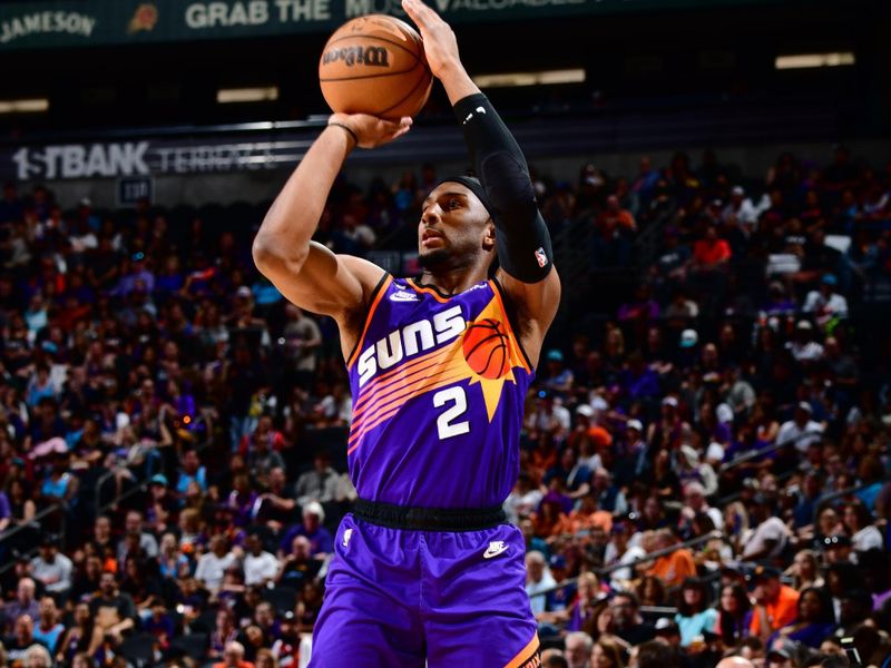 PHOENIX, AZ - APRIL 9: Josh Okogie #2 of the Phoenix Suns shoots a three point basket during the game against the LA Clippers on April 9, 2023 at Footprint Center in Phoenix, Arizona. NOTE TO USER: User expressly acknowledges and agrees that, by downloading and or using this photograph, user is consenting to the terms and conditions of the Getty Images License Agreement. Mandatory Copyright Notice: Copyright 2023 NBAE (Photo by Barry Gossage/NBAE via Getty Images)