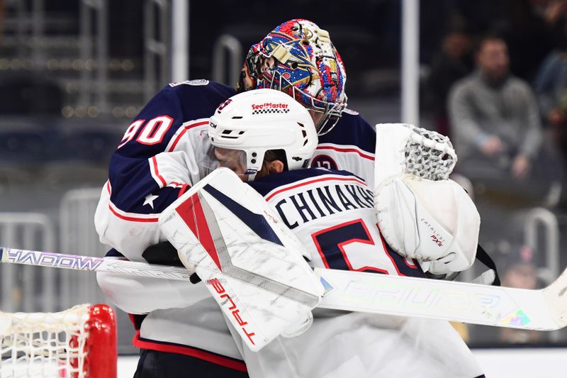 Nov 18, 2024; Boston, Massachusetts, USA;  Columbus Blue Jackets goaltender Elvis Merzlikins (90) celebrates with defenseman David Jiricek (55) after defeating the Boston Bruins at TD Garden. Mandatory Credit: Bob DeChiara-Imagn Images