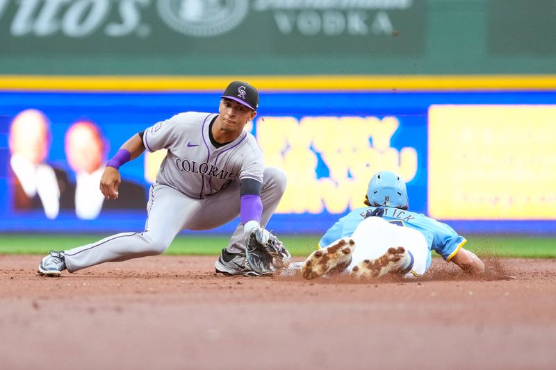 Jun 27, 2025; Milwaukee, Wisconsin, USA;  Milwaukee Brewers right fielder Sal Frelick (10) is caught stealing as Colorado Rockies shortstop Ryan Ritter (8) applies the tag at second base during the first inning at American Family Field. Mandatory Credit: Jeff Hanisch-Imagn Images