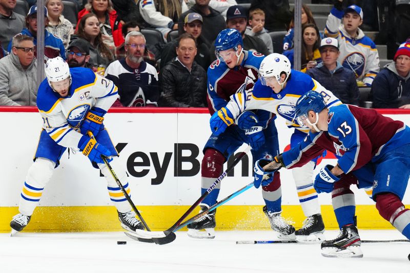 Dec 13, 2023; Denver, Colorado, USA; Buffalo Sabres right wing Kyle Okposo (21) and center Peyton Krebs (19) and Colorado Avalanche defenseman Cale Makar (8) and right wing Valeri Nichushkin (13) battle for puck in the first period at Ball Arena. Mandatory Credit: Ron Chenoy-USA TODAY Sports