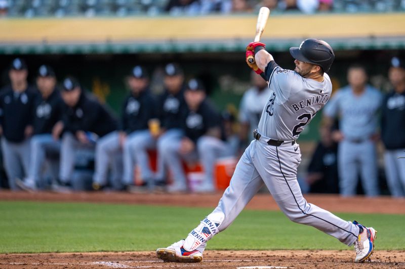 Aug 5, 2024; Oakland, California, USA;  Chicago White Sox left fielder Andrew Benintendi (23) hits a RBI single against the Oakland Athletics during the fourth inning at Oakland-Alameda County Coliseum. Mandatory Credit: Neville E. Guard-USA TODAY Sports