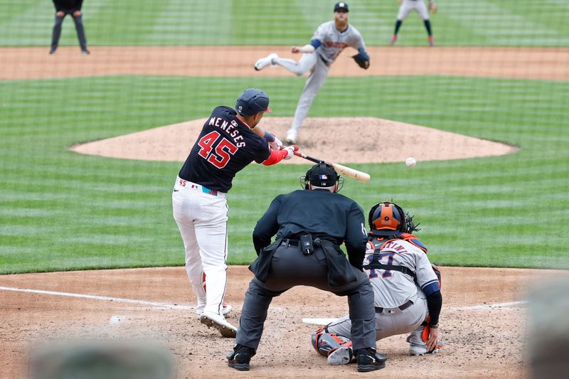 Apr 21, 2024; Washington, District of Columbia, USA; Washington Nationals first base Joey Meneses (45) hits a two run single against the Houston Astros during the fifth inning at Nationals Park. Mandatory Credit: Geoff Burke-USA TODAY Sports