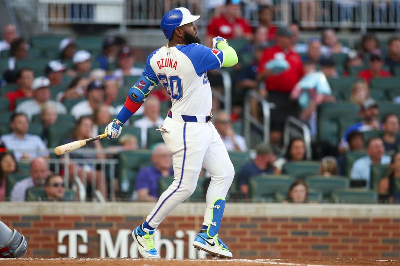 Aug 3, 2024; Atlanta, Georgia, USA; Atlanta Braves designated hitter Marcell Ozuna (20) hits a home run against the Miami Marlins in the third inning at Truist Park. Mandatory Credit: Brett Davis-USA TODAY Sports
