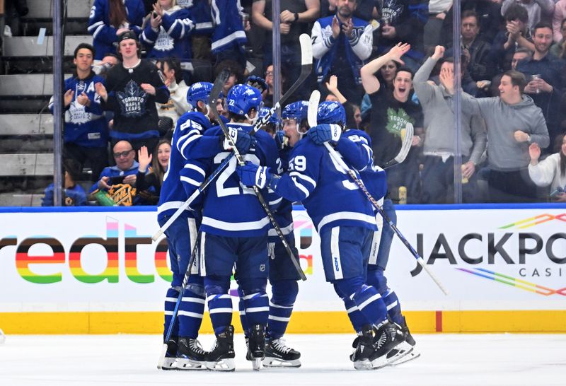 Feb 27, 2024; Toronto, Ontario, CAN;  Toronto Maple Leafs forward Tyler Bertuzzi (59) celebrates with team mates after scoring against the Vegas Golden Knights in the second period at Scotiabank Arena. Mandatory Credit: Dan Hamilton-USA TODAY Sports