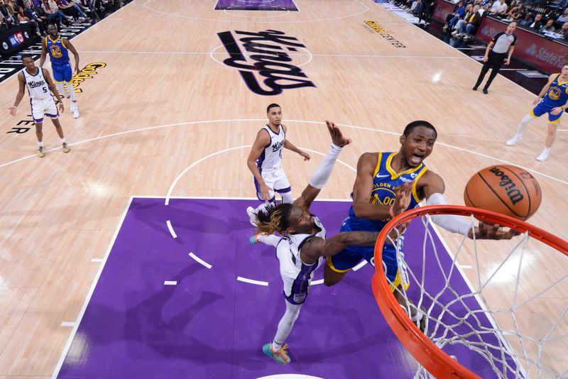 SACRAMENTO, CA - APRIL 16: Jonathan Kuminga #00 of the Golden State Warriors drives to the basket during the game against the Sacramento Kings during the 2024 Play-In Tournament on April 16, 2024 at Golden 1 Center in Sacramento, California. NOTE TO USER: User expressly acknowledges and agrees that, by downloading and or using this Photograph, user is consenting to the terms and conditions of the Getty Images License Agreement. Mandatory Copyright Notice: Copyright 2024 NBAE (Photo by Rocky Widner/NBAE via Getty Images)