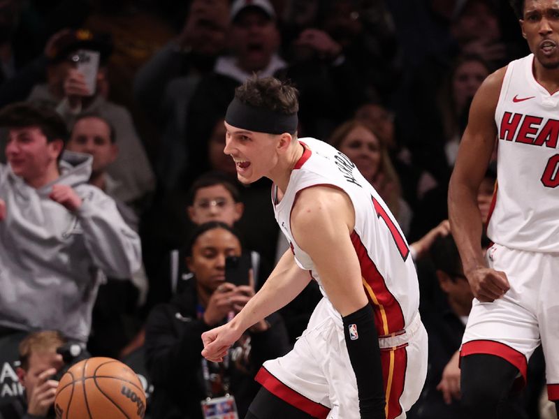 NEW YORK, NEW YORK - JANUARY 15:  Tyler Herro #14 of the Miami Heat celebrates a 95-94 overtime win against the Brooklyn Nets during their game at Barclays Center on January 15, 2024 in New York City.   User expressly acknowledges and agrees that, by downloading and or using this photograph, User is consenting to the terms and conditions of the Getty Images License Agreement.  (Photo by Al Bello/Getty Images)