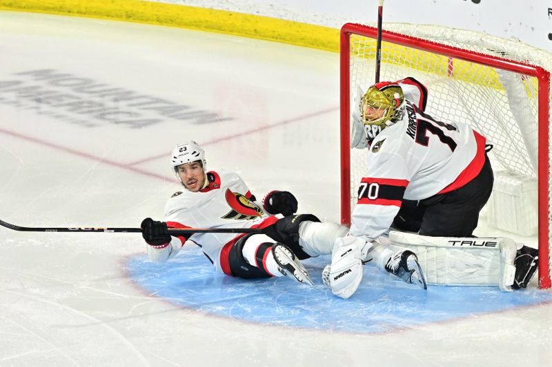 Dec 19, 2023; Tempe, Arizona, USA; Ottawa Senators defenseman Travis Hamonic (23) collides with goaltender Joonas Korpisalo (70) in the first period against the Arizona Coyotes at Mullett Arena. Mandatory Credit: Matt Kartozian-USA TODAY Sports