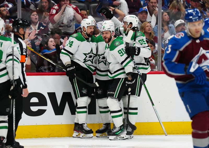 May 17, 2024; Denver, Colorado, USA; Dallas Stars left wing Jamie Benn (14) celebrates his goal scored with center Tyler Seguin (91) and defenseman Thomas Harley (55) and defenseman Miro Heiskanen (4) in the third period against the Colorado Avalanche in game six of the second round of the 2024 Stanley Cup Playoffs at Ball Arena. Mandatory Credit: Ron Chenoy-USA TODAY Sports