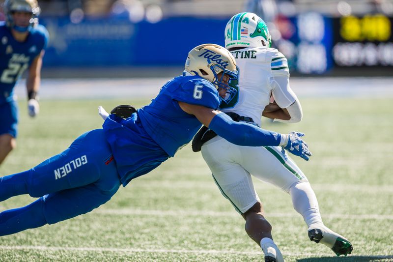 Nov 5, 2022; Tulsa, Oklahoma, USA;  Tulsa Golden Hurricane linebacker Jon-Michael Terry (6) tackles Tulane Green Wave running back Iverson Celestine (8) during the third quarter at Skelly Field at H.A. Chapman Stadium. Tulane won 27-13. Mandatory Credit: Brett Rojo-USA TODAY Sports