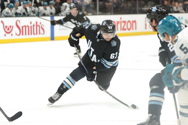 Oct 28, 2024; Salt Lake City, Utah, USA; Utah Hockey Club left wing Matias Maccelli (63) shoots the puck during the second period against the San Jose Sharks at Delta Center. Mandatory Credit: Chris Nicoll-Imagn Images