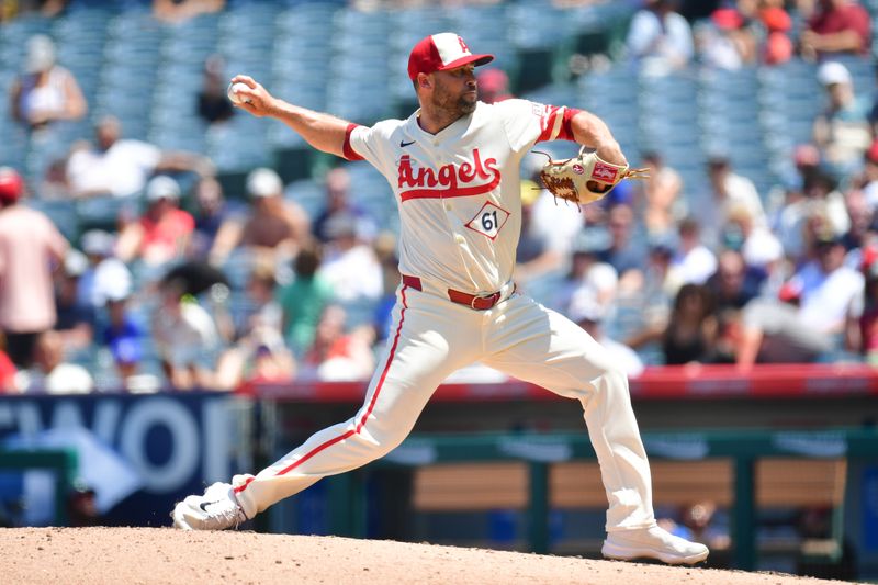 Jul 14, 2024; Anaheim, California, USA; Los Angeles Angels pitcher Hunter Strickland (61) throws against the Seattle Mariners during the fifth inning at Angel Stadium. Mandatory Credit: Gary A. Vasquez-USA TODAY Sports