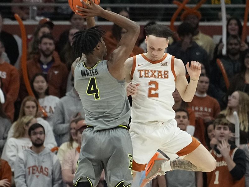 Jan 20, 2024; Austin, Texas, USA; Baylor Bears guard Ja'Kobe Walter (4) shoots over guard Chendall Weaver (2) during the first half at Moody Center. Mandatory Credit: Scott Wachter-USA TODAY Sports