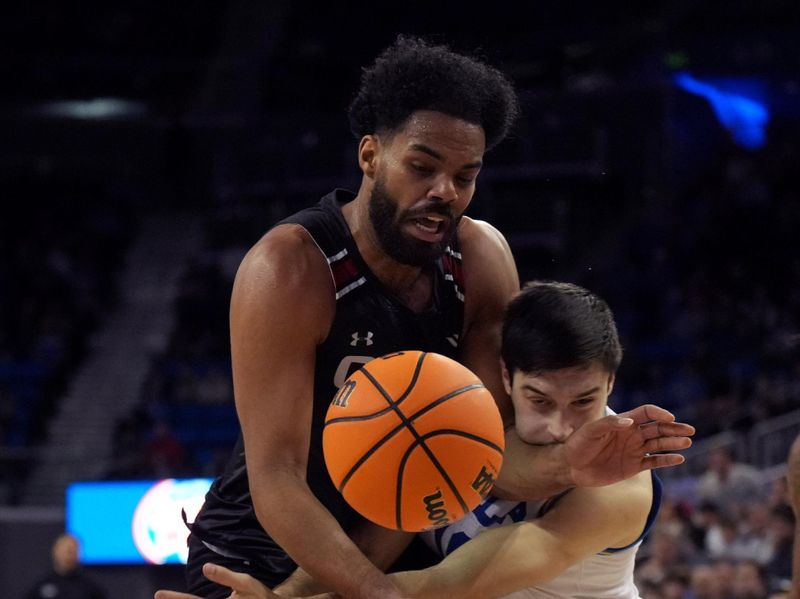 Dec 19, 2023; Los Angeles, California, USA; Cal State Northridge Matadors forward De'Sean Allen-Eikens (25) and UCLA Bruins guard Lazar Stefanovic (10) collide in the second half at Pauley Pavilion presented by Wescom. CSUN defeated UCLA 76-72. Mandatory Credit: Kirby Lee-USA TODAY Sports