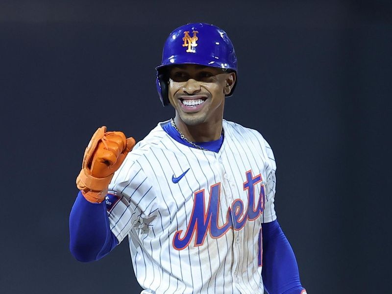 Jun 25, 2024; New York City, New York, USA; New York Mets shortstop Francisco Lindor (12) reacts after reaching second base on an error by New York Yankees third baseman DJ LeMahieu (not pictured) during the eighth inning at Citi Field. Mandatory Credit: Brad Penner-USA TODAY Sports