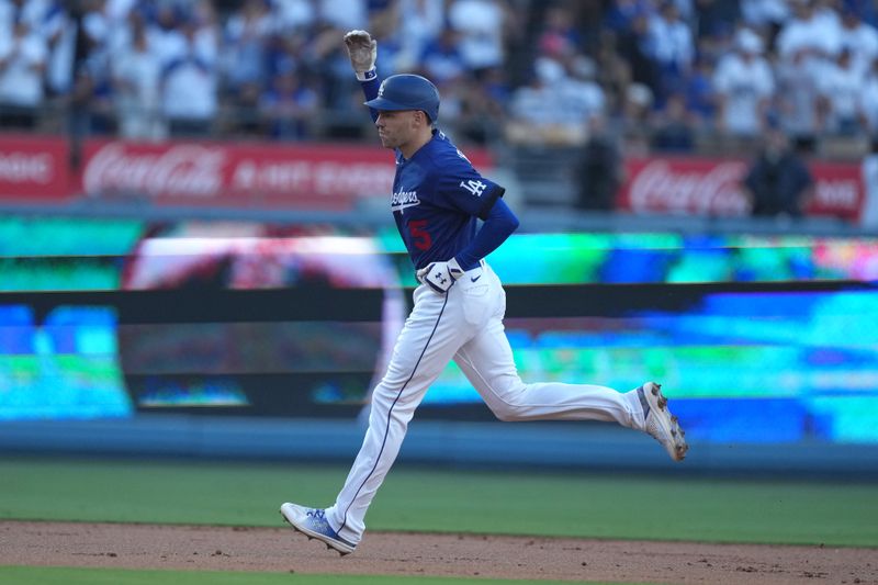 Jul 25, 2023; Los Angeles, California, USA; Los Angeles Dodgers first baseman Freddie Freeman (5) rounds the bases after hitting a solo home run in the first inning against the Toronto Blue Jays at Dodger Stadium. Mandatory Credit: Kirby Lee-USA TODAY Sports