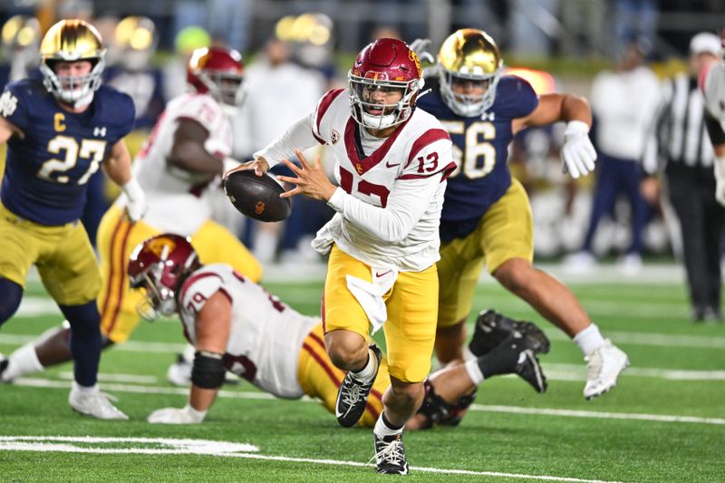 Oct 14, 2023; South Bend, Indiana, USA; USC Trojans quarterback Caleb Williams (13) runs the ball in the second quarter against the Notre Dame Fighting Irish at Notre Dame Stadium. Mandatory Credit: Matt Cashore-USA TODAY Sports