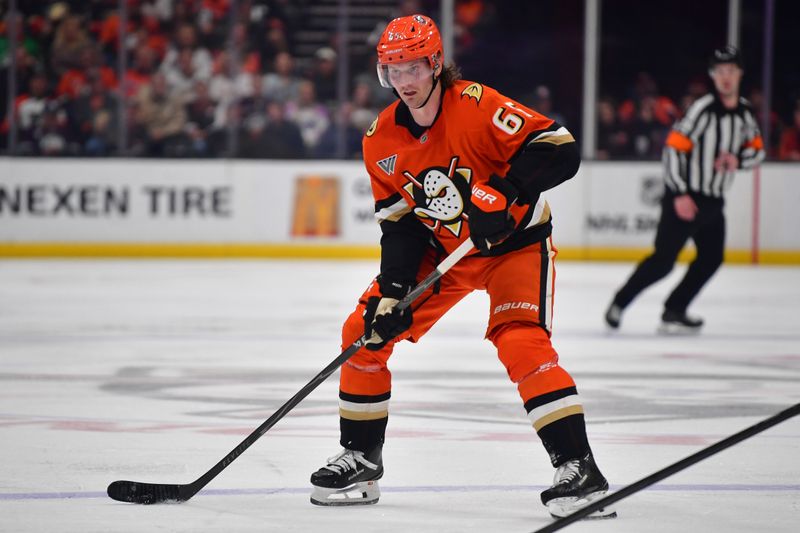 Mar 18, 2026; Anaheim, California, USA; Anaheim Ducks defenseman Jacob Trouba (65) controls the puck against the Philadelphia Flyers during the second period at Honda Center. Mandatory Credit: Gary A. Vasquez-Imagn Images
