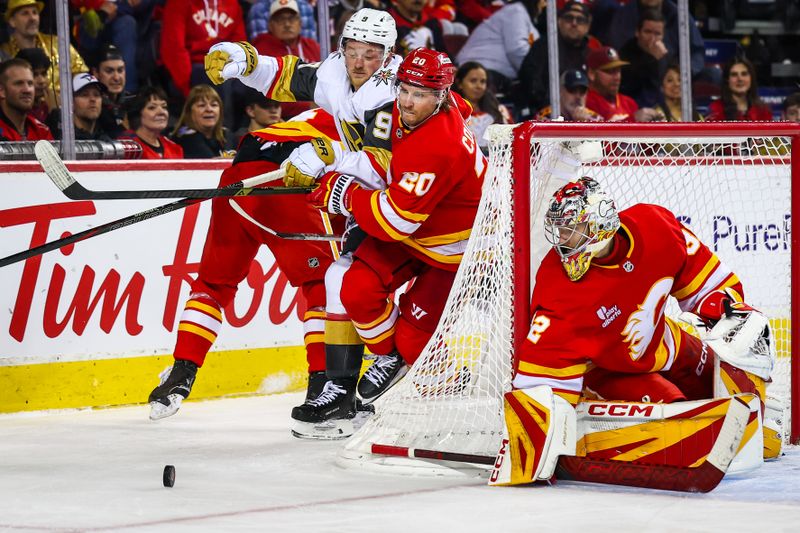 Oct 14, 2025; Calgary, Alberta, CAN; Calgary Flames left wing Blake Coleman (20) and Vegas Golden Knights center Jack Eichel (9) battles for the puck behind the net of Calgary Flames goaltender Dustin Wolf (32) during the third period at Scotiabank Saddledome. Mandatory Credit: Sergei Belski-Imagn Images