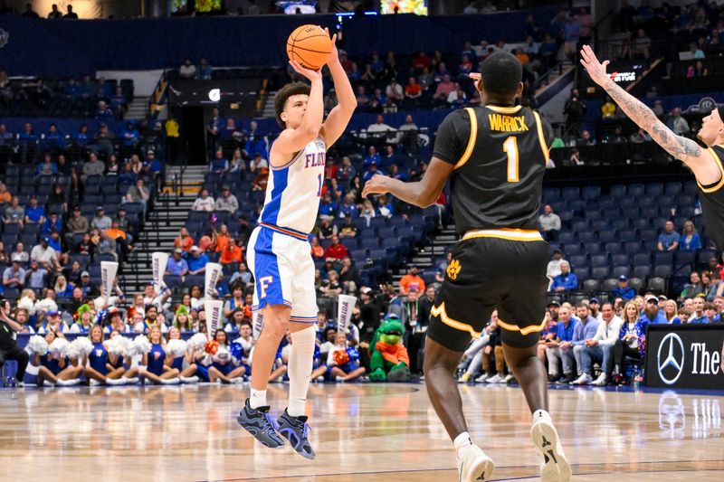 Mar 14, 2025; Nashville, TN, USA;  Florida Gators guard Walter Clayton Jr. (1) shoots a three point basket against the Missouri Tigers during the first half at Bridgestone Arena. Mandatory Credit: Steve Roberts-Imagn Images