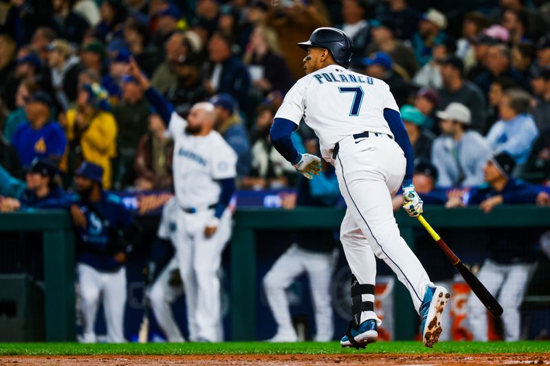 Apr 29, 2025; Seattle, Washington, USA; Seattle Mariners designated hitter Jorge Polanco (7) hits a three-run home run against the Los Angeles Angels during the second inning at T-Mobile Park. Mandatory Credit: Joe Nicholson-Imagn Images