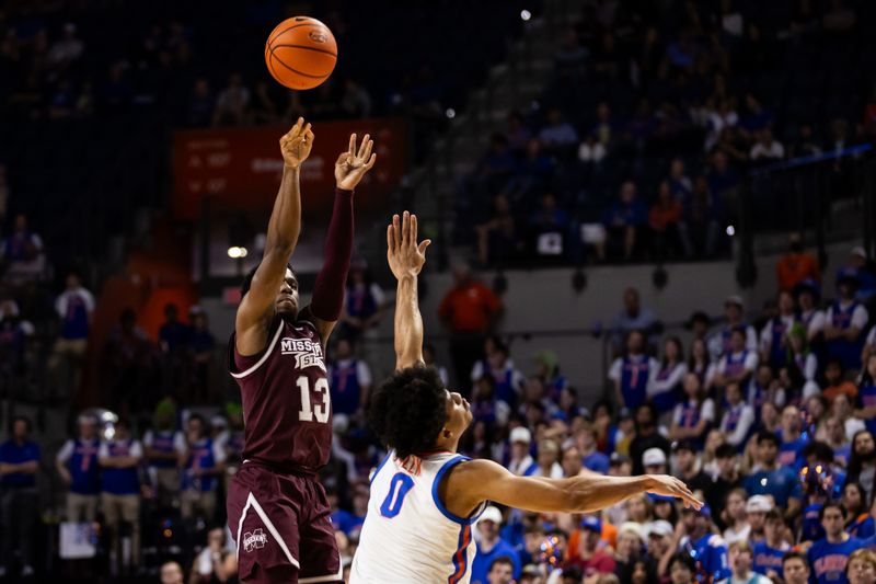 Jan 24, 2024; Gainesville, Florida, USA; Mississippi State Bulldogs guard Josh Hubbard (13) shoots over Florida Gators guard Zyon Pullin (0) during the first half at Exactech Arena at the Stephen C. O'Connell Center. Mandatory Credit: Matt Pendleton-USA TODAY Sports