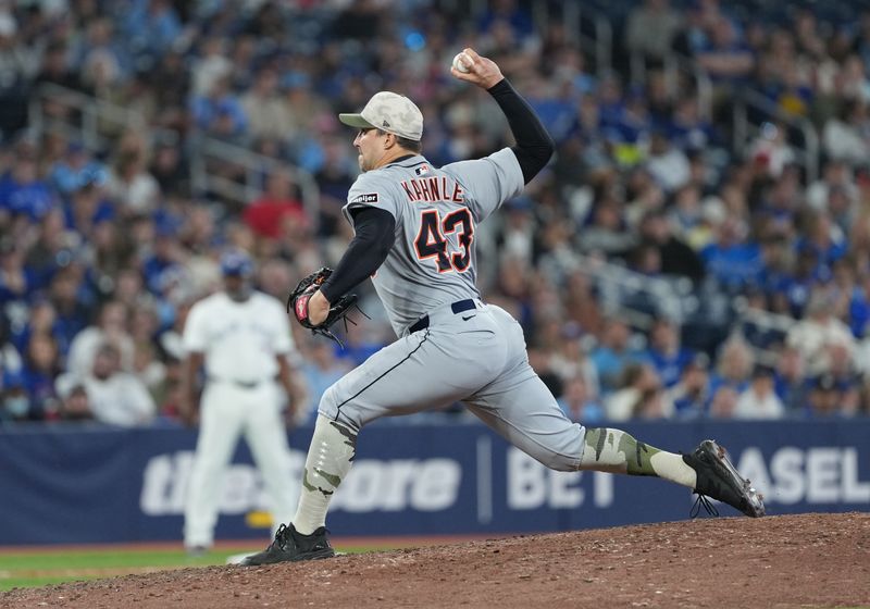 May 18, 2025; Toronto, Ontario, CAN; Detroit Tigers pitcher Tommy Kahnle (43) throws a pitch against the Toronto Blue Jays during the eighth inning at Rogers Centre. Mandatory Credit: Nick Turchiaro-Imagn Images