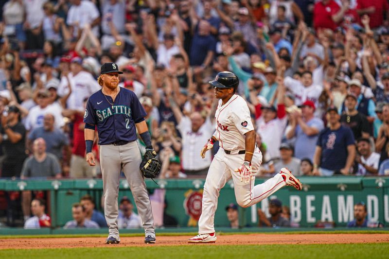 Jul 31, 2024; Boston, Massachusetts, USA; Boston Red Sox third baseman Rafael Devers (11) rounds the bases after hitting a double to center field to drive in the winning run against the Seattle Mariners in the tenth inning at Fenway Park. Mandatory Credit: David Butler II-USA TODAY Sports