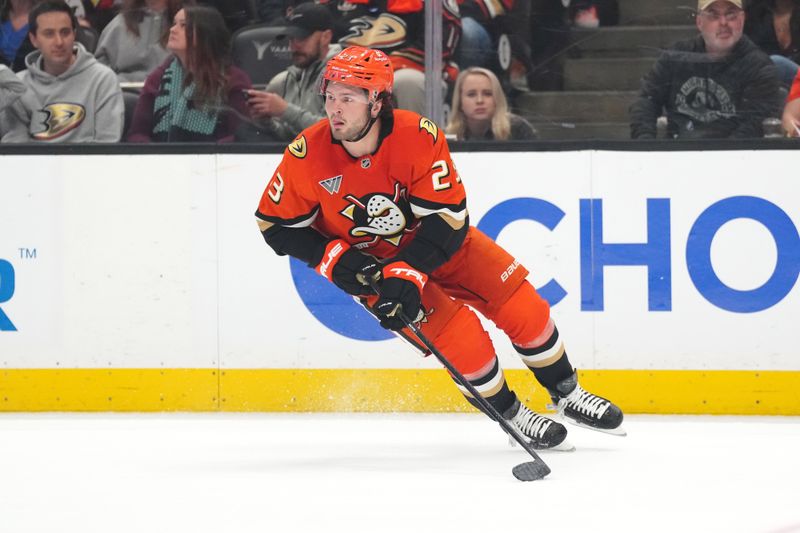 Apr 13, 2025; Anaheim, California, USA; Anaheim Ducks center Mason McTavish (23) skates with the puck against the Colorado Avalanche in the first period at Honda Center. Mandatory Credit: Kirby Lee-Imagn Images