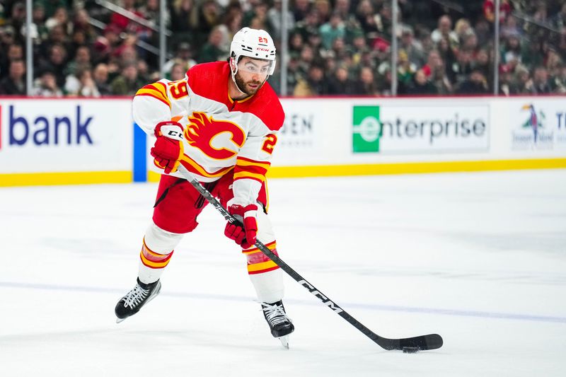 Jan 2, 2024; Saint Paul, Minnesota, USA; Calgary Flames center Dillon Dube (29) passes during the first period against the Minnesota Wild at Xcel Energy Center. Mandatory Credit: Brace Hemmelgarn-USA TODAY Sports