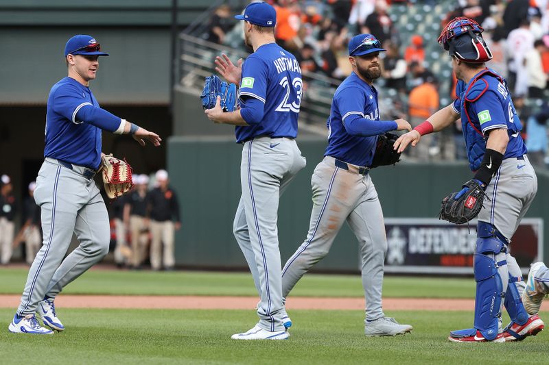 Apr 13, 2025; Baltimore, Maryland, USA; Toronto Blue Jays players celebrate after a game against the Baltimore Orioles at Oriole Park at Camden Yards. Mandatory Credit: Daniel Kucin Jr.-Imagn Images
