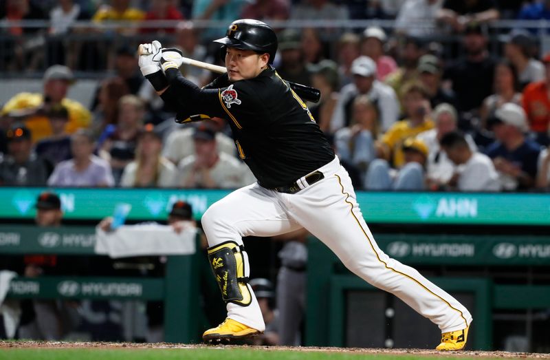 Jul 15, 2023; Pittsburgh, Pennsylvania, USA;  Pittsburgh Pirates designated hitter Ji Man Choi (91) hits a single against the San Francisco Giants during the sixth inning at PNC Park. Mandatory Credit: Charles LeClaire-USA TODAY Sports