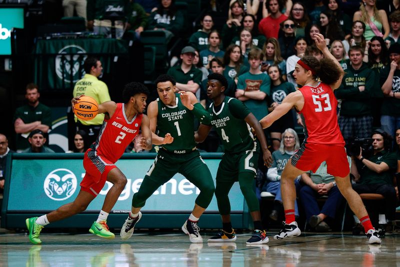 Mar 3, 2023; Fort Collins, Colorado, USA; New Mexico Lobos guard Donovan Dent (2) controls the ball against Colorado State Rams guard John Tonje (1) as guard Isaiah Stevens (4) and forward Josiah Allick (53) defend in the second half at Moby Arena. Mandatory Credit: Isaiah J. Downing-USA TODAY Sports