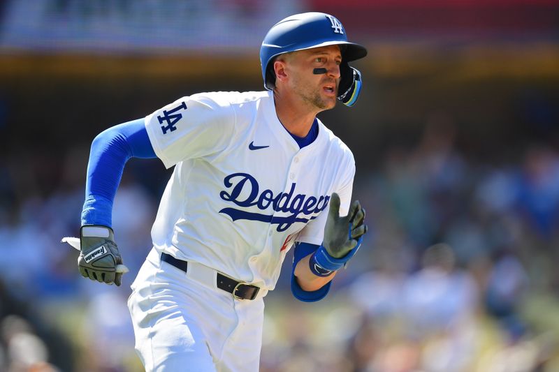 Jul 25, 2024; Los Angeles, California, USA; Los Angeles Dodgers shortstop Nick Ahmed (12) runs after hitting a solo home run against the San Francisco Giants during the eighth inning at Dodger Stadium. Mandatory Credit: Gary A. Vasquez-USA TODAY Sports