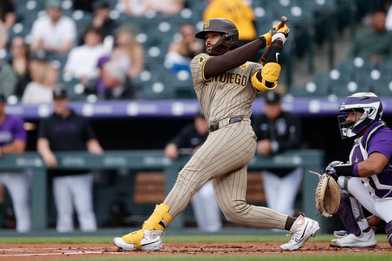 Apr 22, 2024; Denver, Colorado, USA; San Diego Padres catcher Luis Campusano (12) hits a double in the second inning against the Colorado Rockies at Coors Field. Mandatory Credit: Isaiah J. Downing-USA TODAY Sports