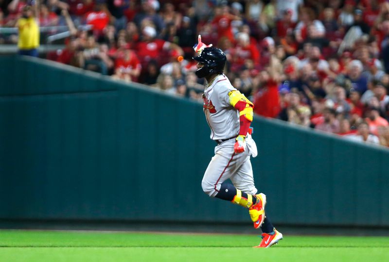 Jun 23, 2023; Cincinnati, Ohio, USA; Atlanta Braves right fielder Ronald Acuna Jr. (13) reacts as he runs the bases after hitting a solo home run against the Cincinnati Reds during the eighth at Great American Ball Park. Mandatory Credit: David Kohl-USA TODAY Sports