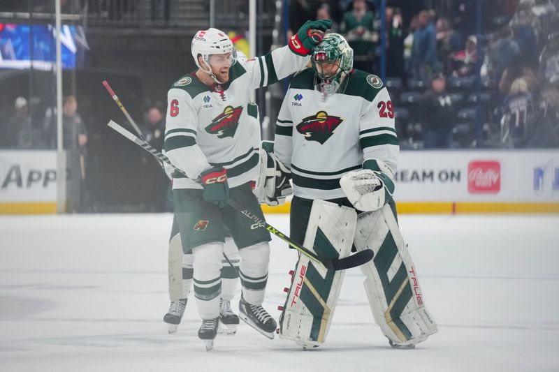 Jan 6, 2024; Columbus, Ohio, USA;  Minnesota Wild defenseman Dakota Mermis (6) celebrates with teammate goaltender Marc-Andre Fleury (29) after defeating the Columbus Blue Jackets in the overtime period at Nationwide Arena. Mandatory Credit: Aaron Doster-USA TODAY Sports